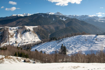 Fototapeta na wymiar Winter landscape in Transylvania , Romania and Carpathian mountains 