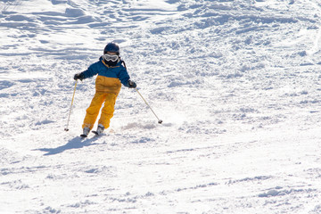 Fototapeta na wymiar Child on ski track in winter time 