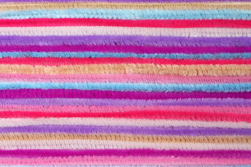 Background - colorful fluffy decorative wires, located close to each other