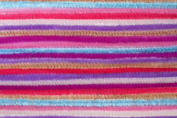 Background - colorful fluffy decorative wires, located close to each other