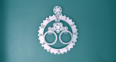 Modern designed futuristic fashion wall clock with mechanism. Silver color on agreen-blue wall