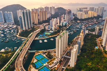 Fototapeta na wymiar Drone flying overlooking view of the Traditional Fishing Trawlers in the Aberdeen Bay Famous Floating Village in the Southern part of Hong Kong Island