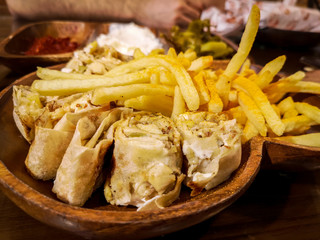 Delicious shawarma on wooden background - Eastern food and fries