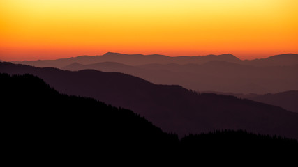 Silhouette of the mountains at dusk , Rarau mountains in Bucovina , Romania 