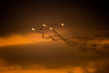 Airplane silhouette in the sky at sunset time during air show BIAS , Bucharest , Romania  