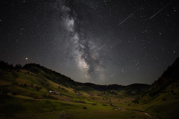 Transylvania village in summer night with milky way on a clear sky 