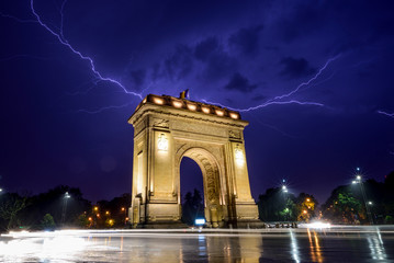 Lightning storm  in Bucharest city , Romania  with triumphal arch  - obrazy, fototapety, plakaty