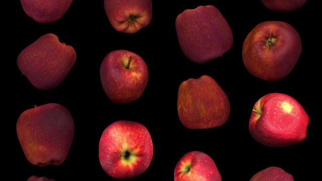 Realistic render of falling "Red Delicious" apples on black background. The video is seamlessly looping, and the objects are 3D scanned from real apples.