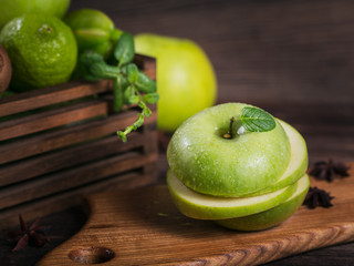 Set of green fruits for healthy diet and detox: apple, lime, kiwi, mango, carambola and mint.