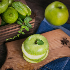 Set of green fruits for healthy diet and detox: apple, lime, kiwi, mango, carambola and mint.