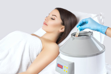 The blood tube is removed from the medical centrifuge for plasma lifting. Prp procedure.