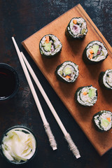 Sushi from cauliflower, avocado and tuna. Traditional Asian food. Diet healthy food concept. Cereal free. Gluten free. Dairy free. AIP Autoimmune Paleo.