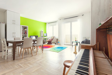 Modern stylish apartment interior with acoustic piano