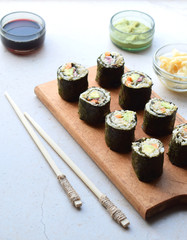 Sushi from cauliflower, avocado and tuna. Traditional Asian food. Diet healthy food concept. Cereal free. Gluten free. Dairy free. AIP Autoimmune Paleo.