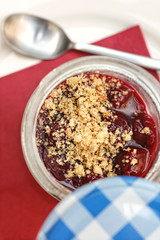 Panna Cotta Cheesecake with sour cherries in a glass jar