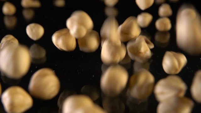 Nuts falling on a black surface - Slow Motion 240 fps