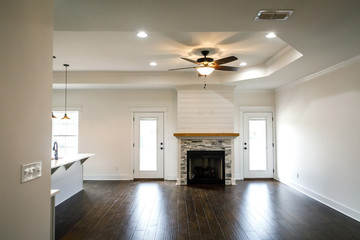 Modern Open Spacious Living Room With Tiled Fireplace and Custom Mantle and Dark Wood Floors