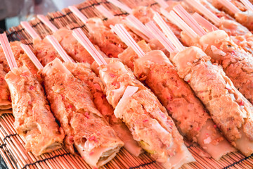Pile of Hashimaki Japanese pancake on a stick from Hiroshima