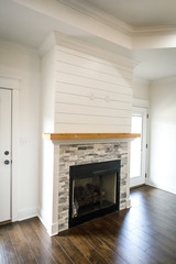 Modern Open Spacious Living Room With Tiled Fireplace and Custom Mantle and Dark Wood Floors