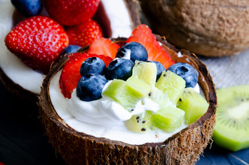 delicate dessert with cream, powdered sugar and berries