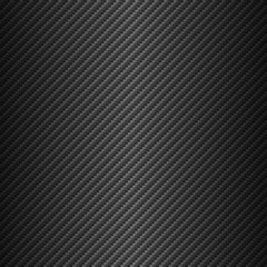 Vector carbon fiber texture. Dark background with lighting.