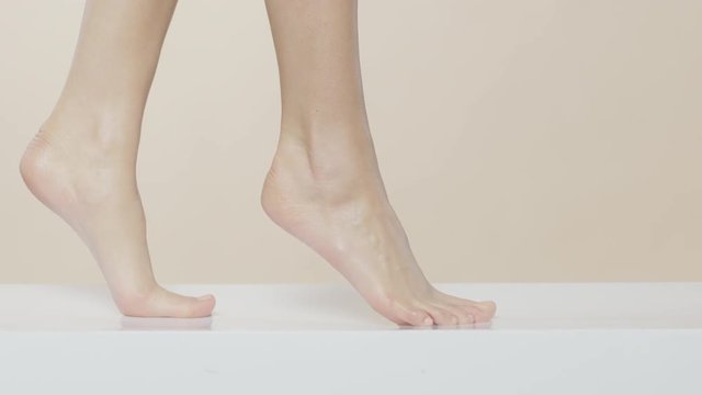 Female feet walking on a white surface, recorded Red Monstro and using Briese Focus 140 HMI.