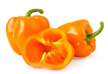 Two orange bell peppers and half sliced rings close-up on a white. Isolated.