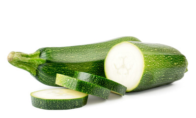 Zucchini, half and sliced pieces on a white, isolated.