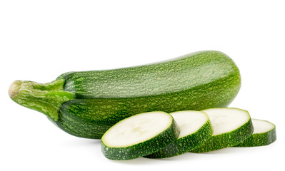 Fresh zucchini and sliced slices close up on a white. Isolated.