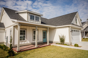 Modern new Construction White Siding Cottage House for Sale in Suburbs with Turquoise Door