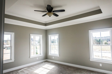 Modern new Construction Master bedroom with Tray ceiling and fan