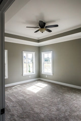 Modern new Construction Master bedroom with Tray ceiling and fan