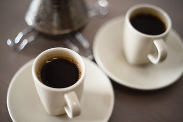 Black Turk coffee in ivory coffee cups minimalist style