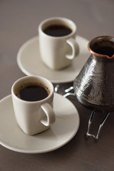 Black Turk coffee prepared in Turkish coffee pot minimalist style