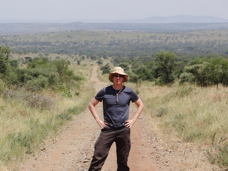 Male Tourist on a safari in the Ngorongoro Crater ion Tanzania, Africa.