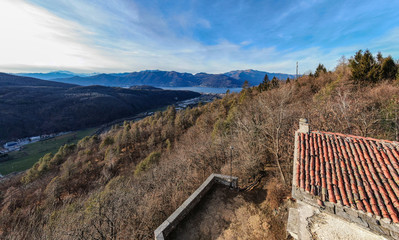 Obraz premium Panoramic view of Luino on the Lake Maggiore in a cloudy day, province of Varese, Italy