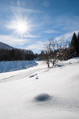 Cross-country skiing track trail in sunny snow-covered holiday resort Hohentauern