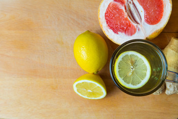 Green tea with lemon, ginger, grapefruit, mint. Top view