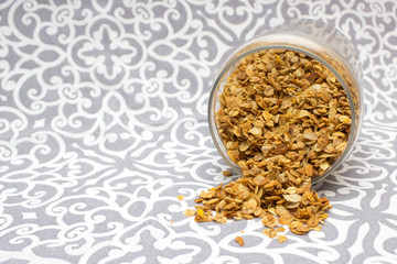 Granola, Oatmeal for breakfast. Granola with milk, spilled granola. Bank of granola. Oatmeal