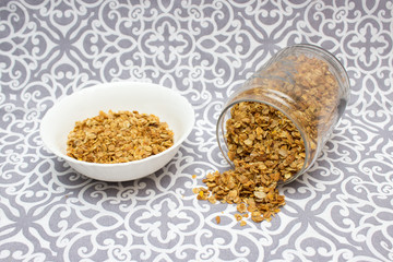 Granola, Oatmeal for breakfast. Granola with milk, spilled granola. Bank of granola. Oatmeal