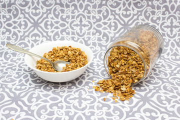 Granola, Oatmeal for breakfast. Granola with milk, spilled granola. Bank of granola. Oatmeal