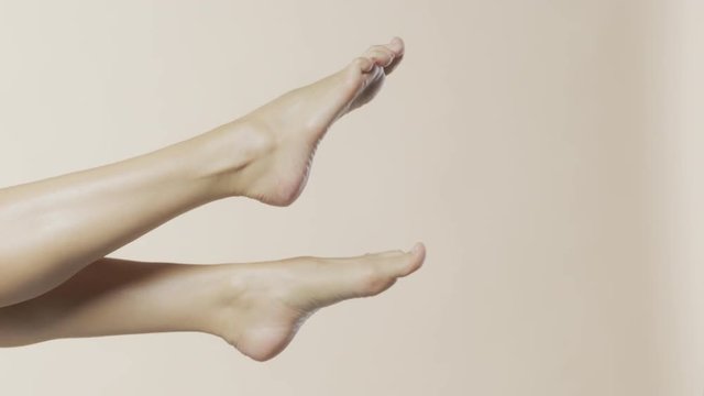 Female feet moving in the air, recorded Red Monstro and using Briese Focus 140 HMI