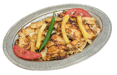 Traditional Turkish Chicken Doner Kebab on copper plate isolated on white