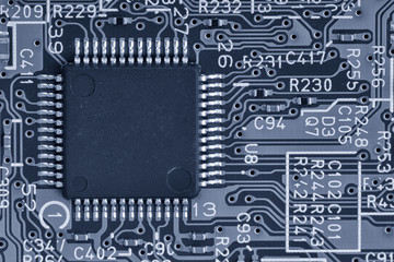 Electronic circuit board close up. Limited depth of field. Black white toned image.