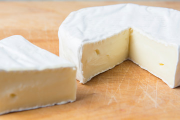 white brie cheese on the kitchen board