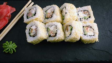 Sushi rolls on a plate.