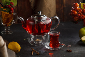 Red tea wooden background