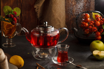 Red tea wooden background