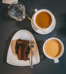 Big chocolate cake and coffee at the coffee shop, Helsinki Finland