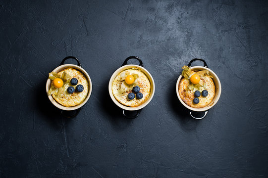 Classic English Rice Pudding. Dark Background, Top View